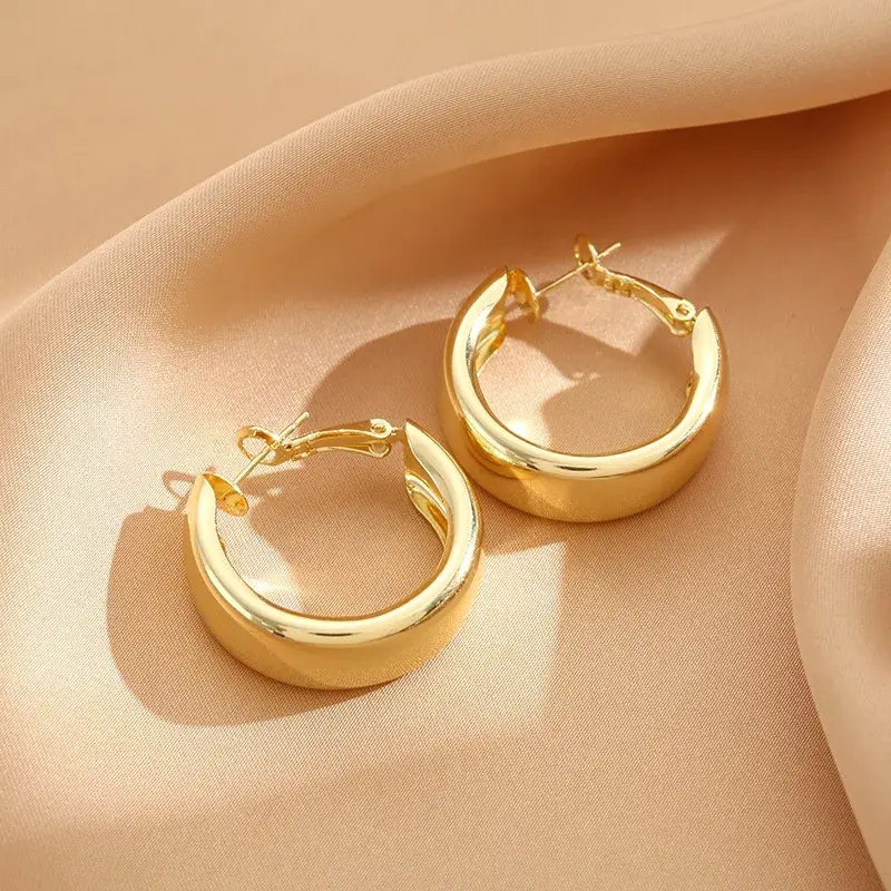 Bold Gold Chunky Hoop Earrings on Satin