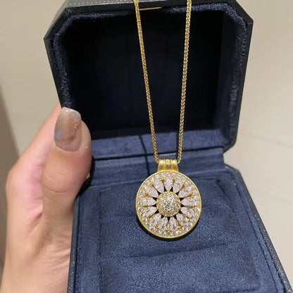 Zircon flower pendant necklace displayed in a deep blue jewelry box